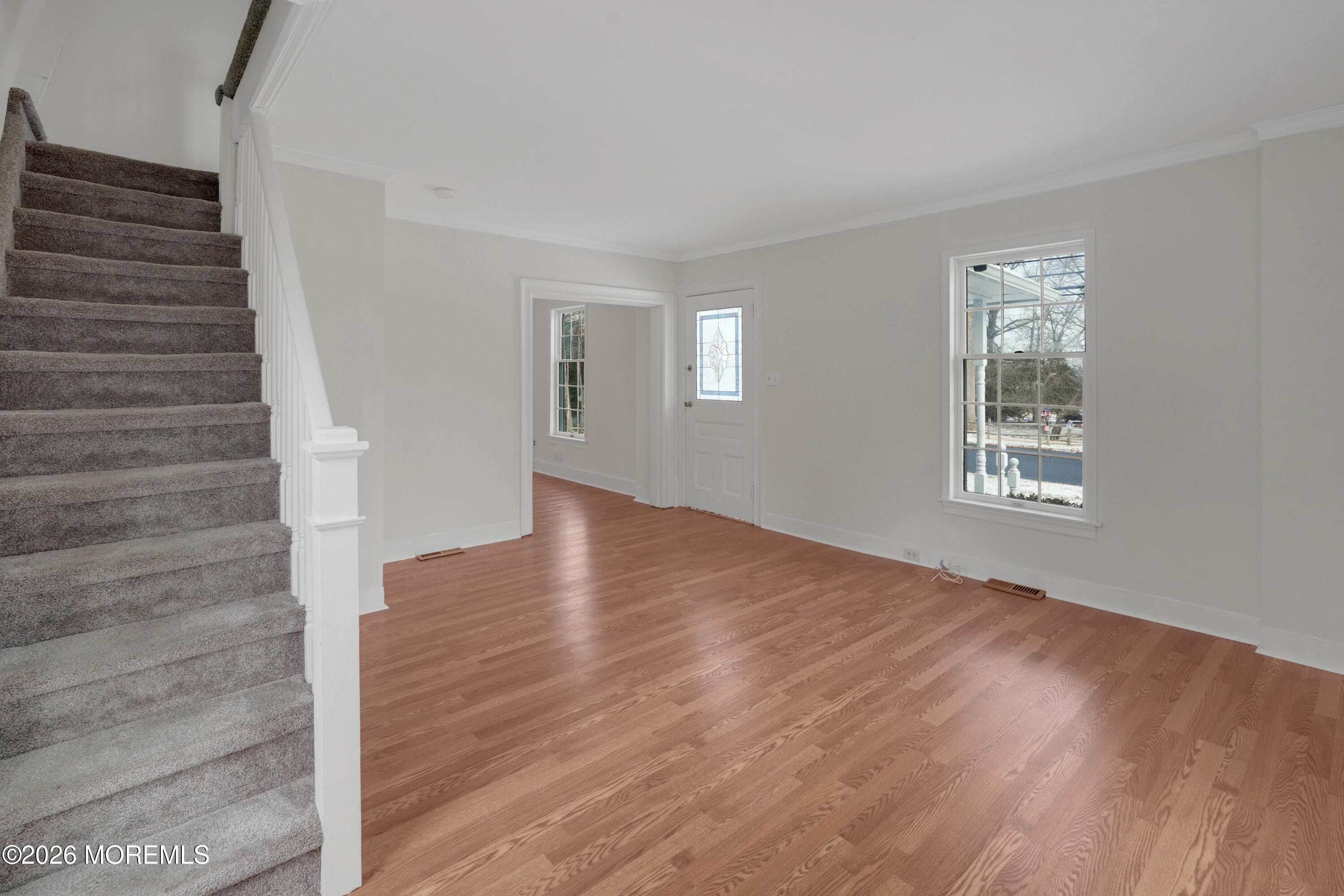 1527 Marconi Road Wall, NJ 07719 - Photo 16 of 25 a view of an empty room with wooden floor and a window