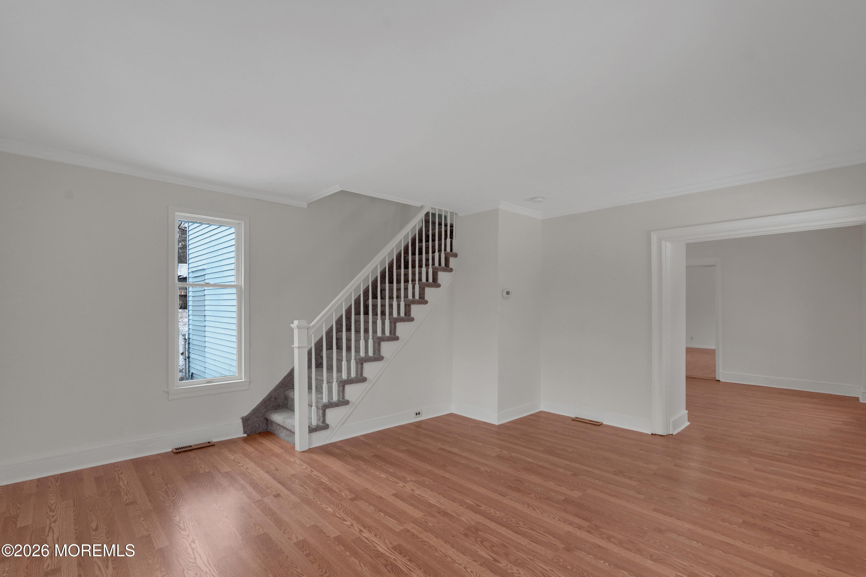 1527 Marconi Road Wall, NJ 07719 - Photo 17 of 25 a view of an empty room with wooden floor and a window