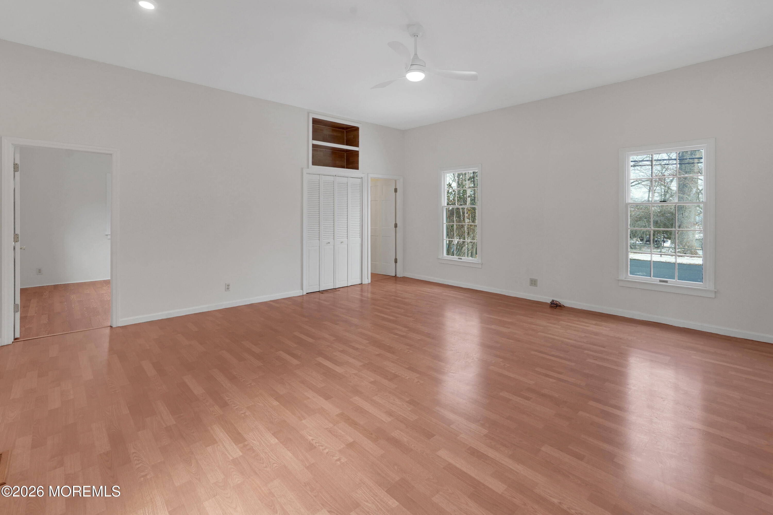 1527 Marconi Road Wall, NJ 07719 - Photo 20 of 25 a view of an empty room with wooden floor and a window