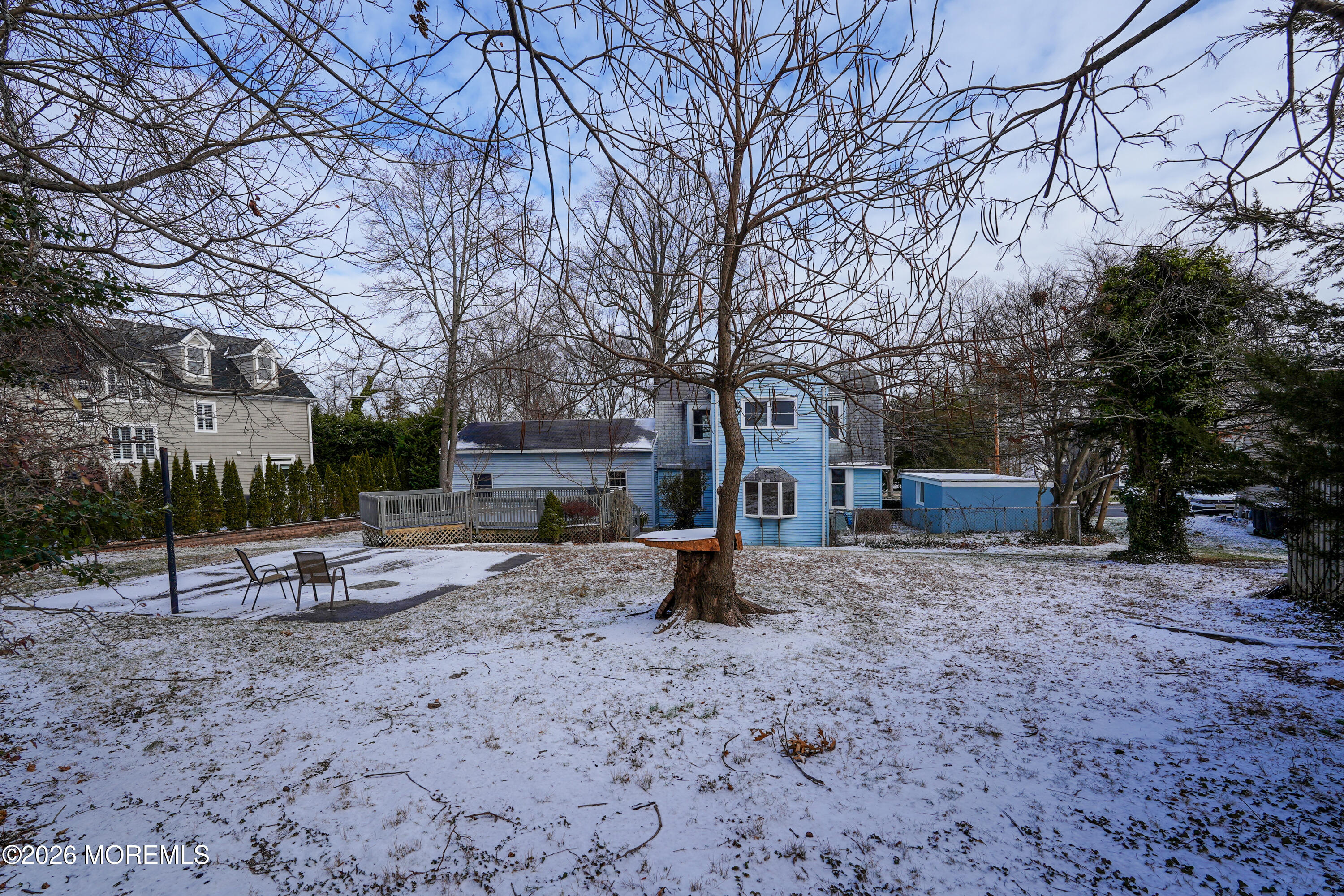 1527 Marconi Road Wall, NJ 07719 - Photo 8 of 25 a view of a backyard with table and chairs under a large tree