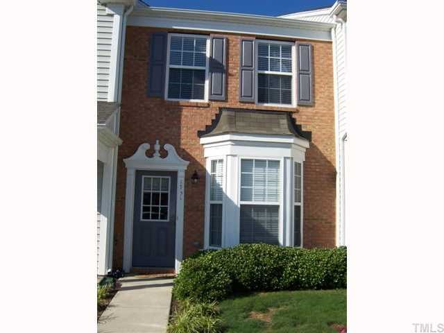 1731 Grace Brook Road Raleigh, NC 27609 - Photo 1 of 11 a view of a brick house with large windows and plants