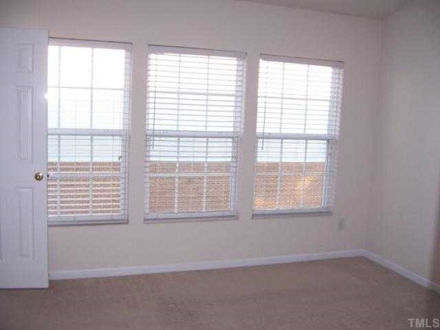 1731 Grace Brook Road Raleigh, NC 27609 - Photo 11 of 11 an empty room with a window