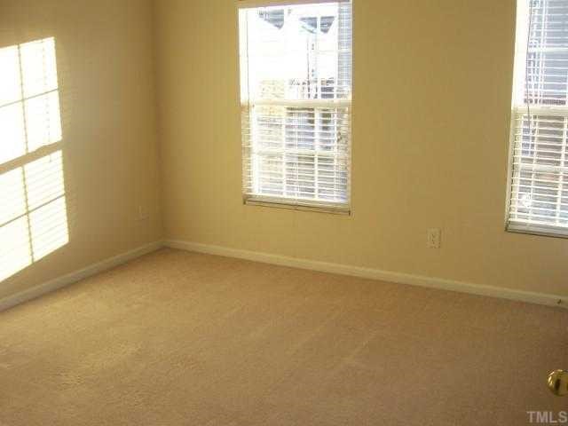 1731 Grace Brook Road Raleigh, NC 27609 - Photo 6 of 11 an empty room with a window