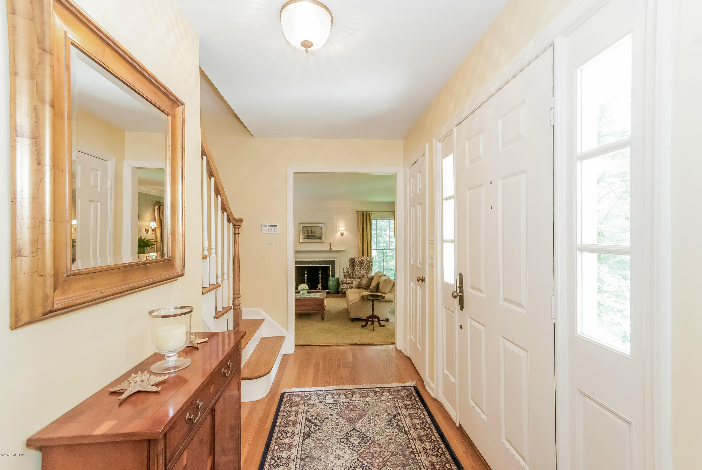45 Old Stone Bridge Road Cos Cob, CT 06807 - Photo 3 of 35 a hallway with white cabinets and wooden floor