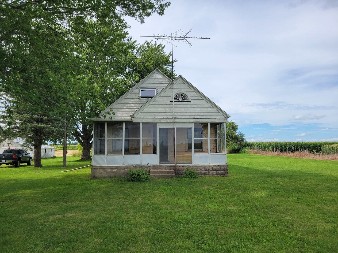 1452 Sterling Road Amboy, IL 61310 - Photo 3 of 43 a front view of house with a garden and trees