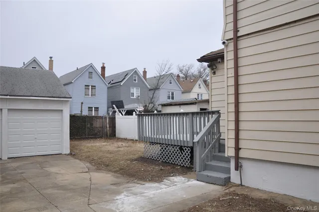 a view of a house with wooden fence