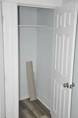 a view of front door with wooden floor