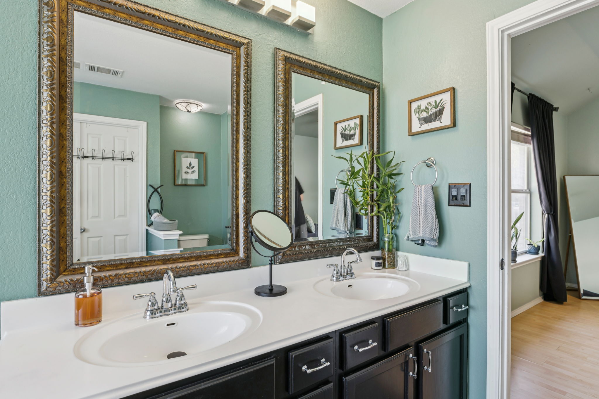 2412 Chestnut Path Round Rock, TX 78664 - Photo 13 of 26 Double vanities with sleek countertops offer both function and visual appeal in this well-appointed bathroom.