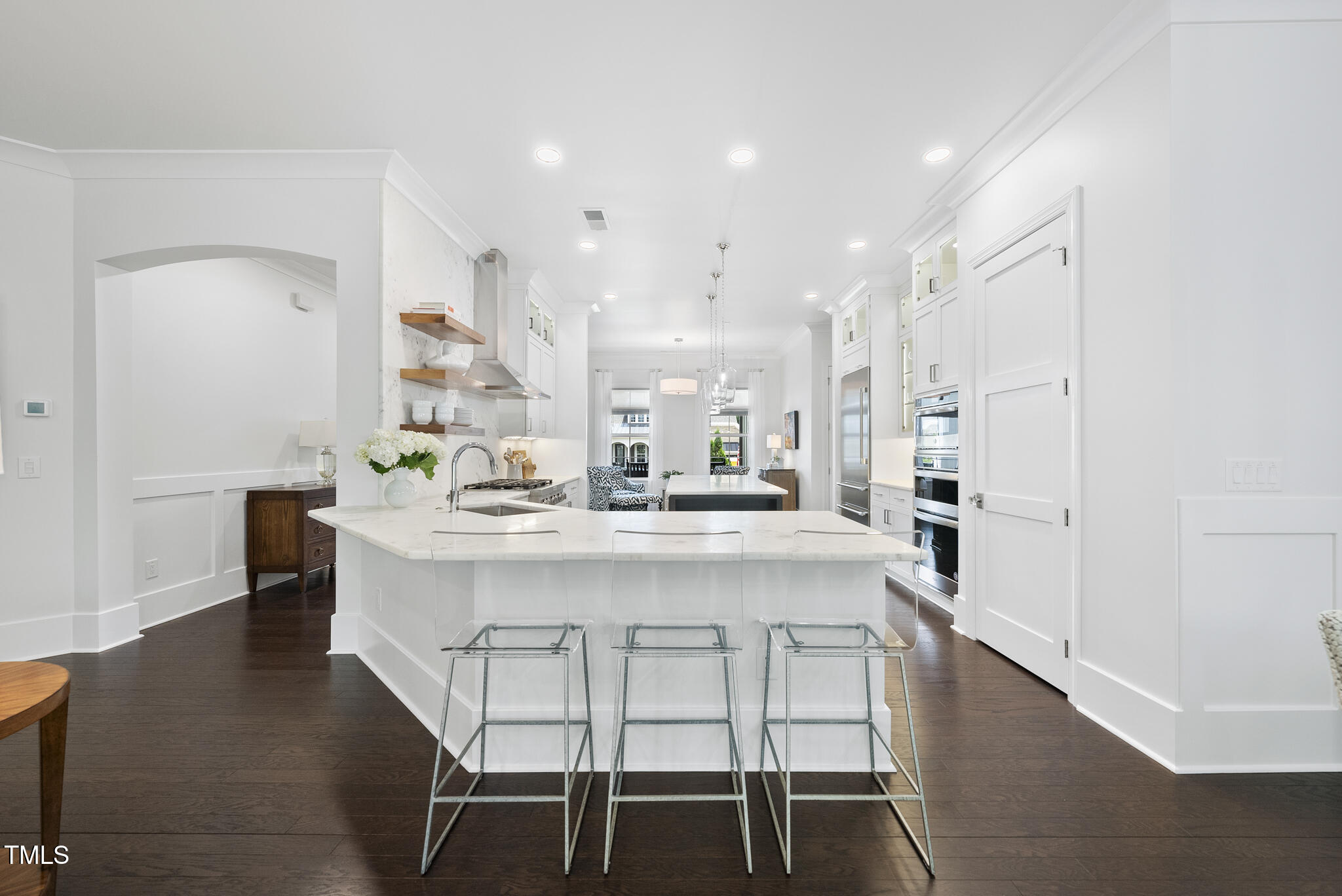 129 Damsire Way Cary, NC 27513 - Photo 12 of 33 a white kitchen with a table and chairs