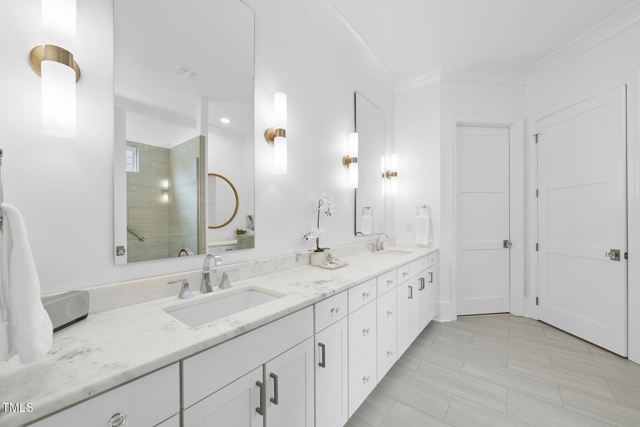 129 Damsire Way Cary, NC 27513 - Photo 16 of 33 a bathroom with a double vanity sink and a mirror