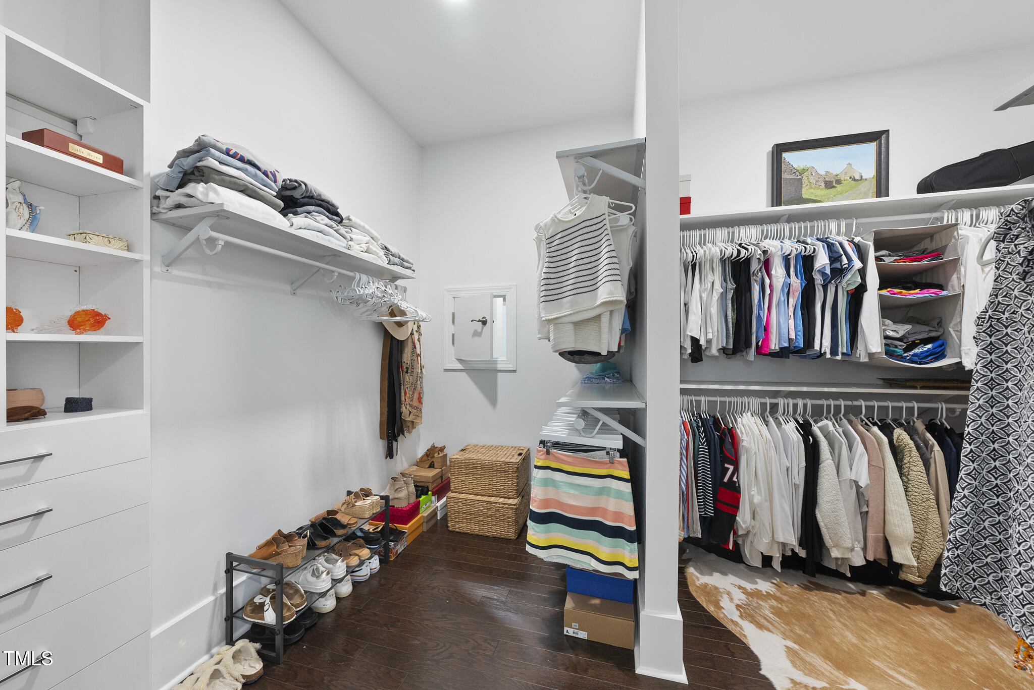129 Damsire Way Cary, NC 27513 - Photo 20 of 33 a view of walk in closet with clothes and shoes