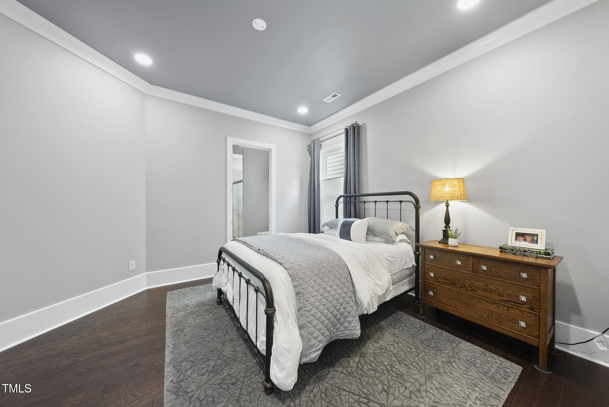 129 Damsire Way Cary, NC 27513 - Photo 24 of 33 a bedroom with a bed and window