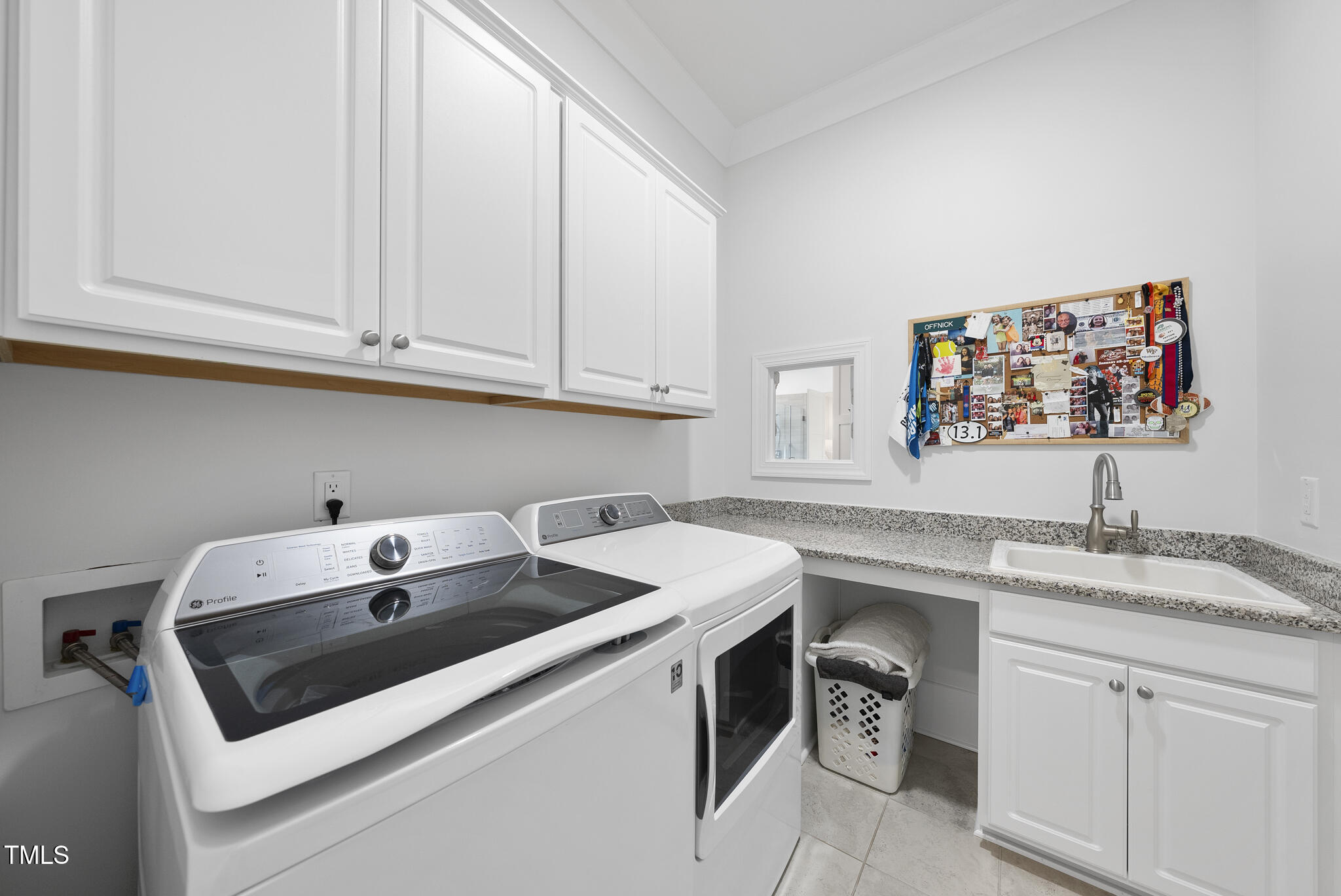 129 Damsire Way Cary, NC 27513 - Photo 28 of 33 a utility room with sink dryer and washer