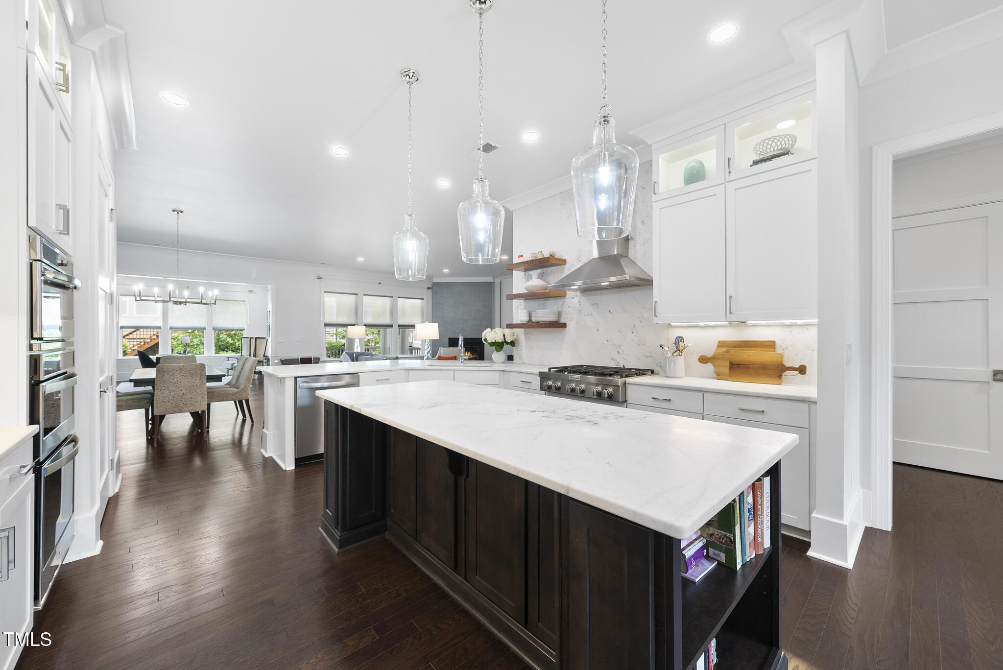 129 Damsire Way Cary, NC 27513 - Photo 4 of 33 a kitchen with a stove a sink dishwasher and a refrigerator with wooden floor