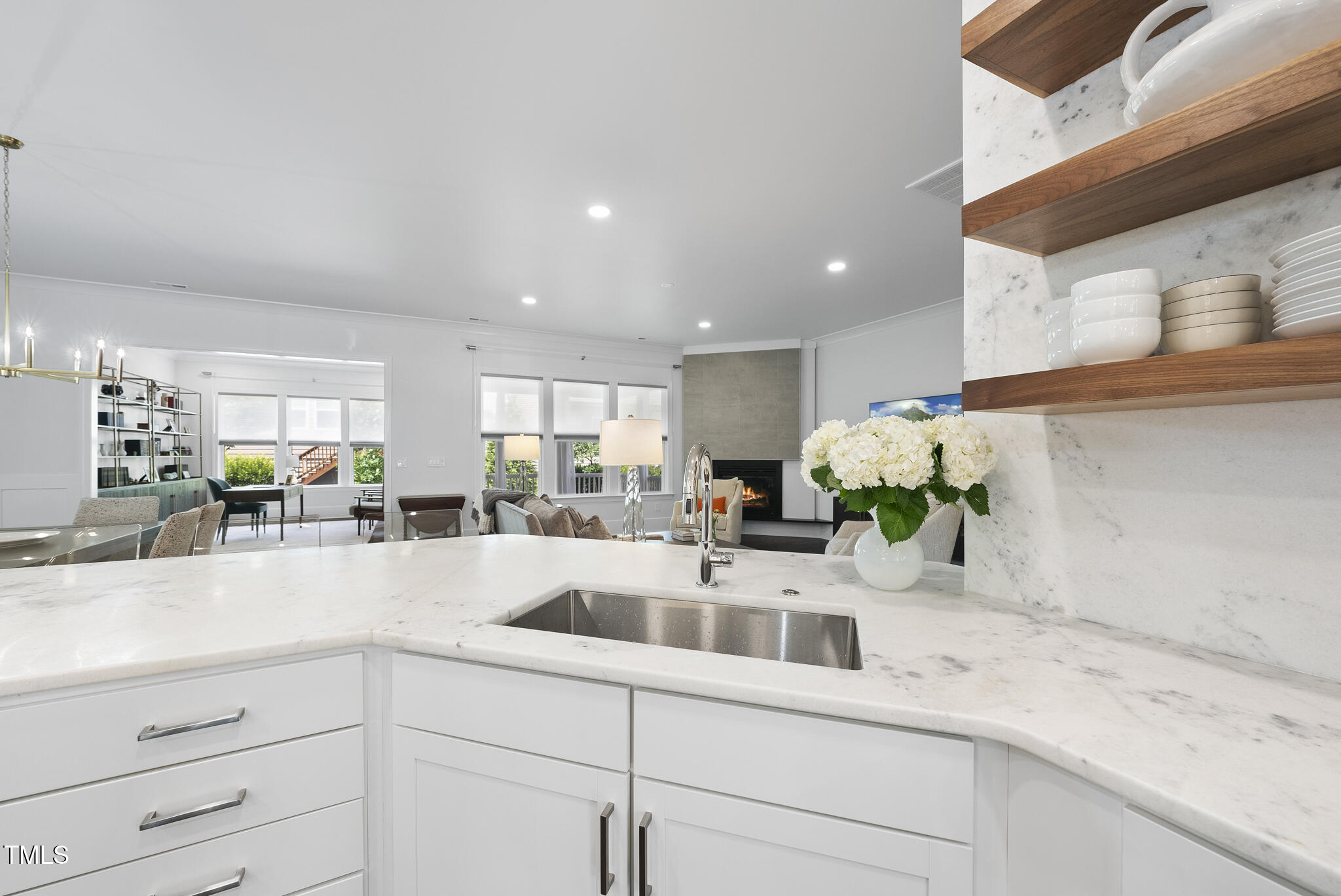 129 Damsire Way Cary, NC 27513 - Photo 7 of 33 a kitchen with stainless steel appliances kitchen island granite countertop counter top space and cabinets