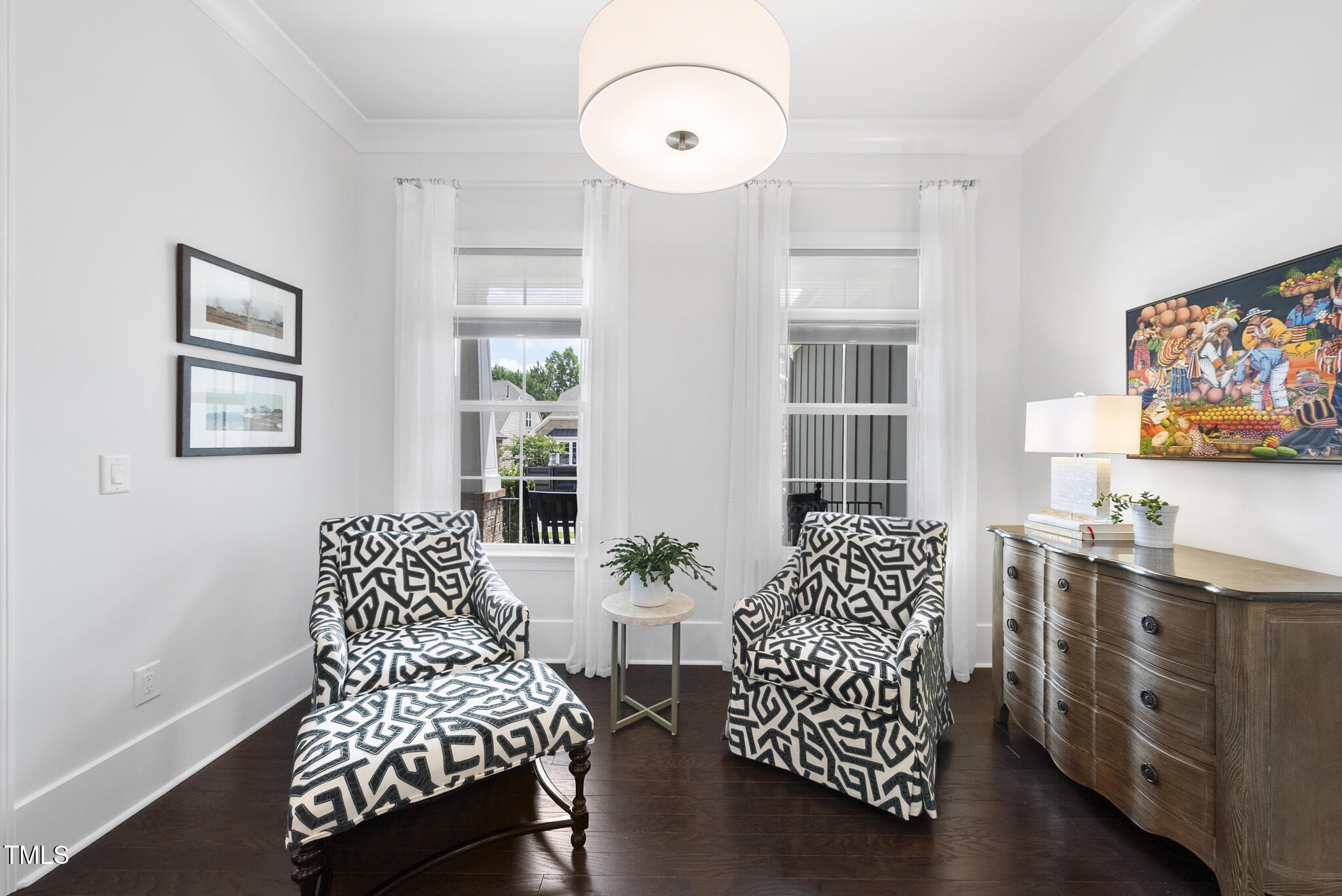129 Damsire Way Cary, NC 27513 - Photo 9 of 33 a living room with furniture and a chandelier