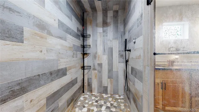 a bathroom with a bathtub and shower