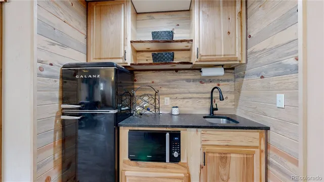 a kitchen with stainless steel appliances granite countertop a stove and a refrigerator