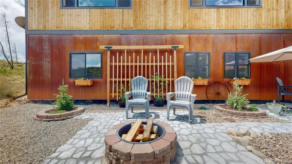 a table and chairs in front of a door