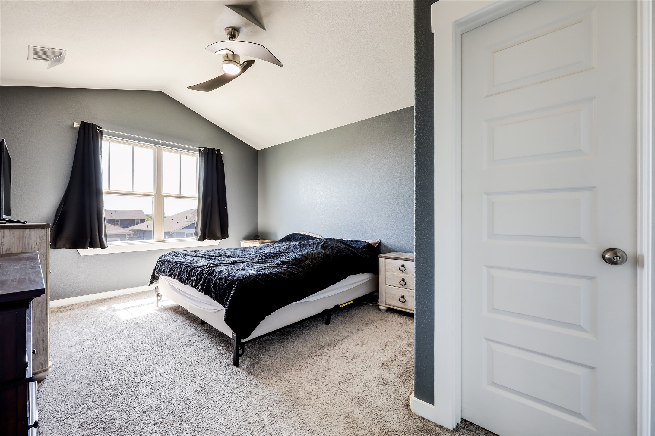 249 Trellis Boulevard Leander, TX 78641 - Photo 11 of 18 a bedroom with a bed lamp closet and large window