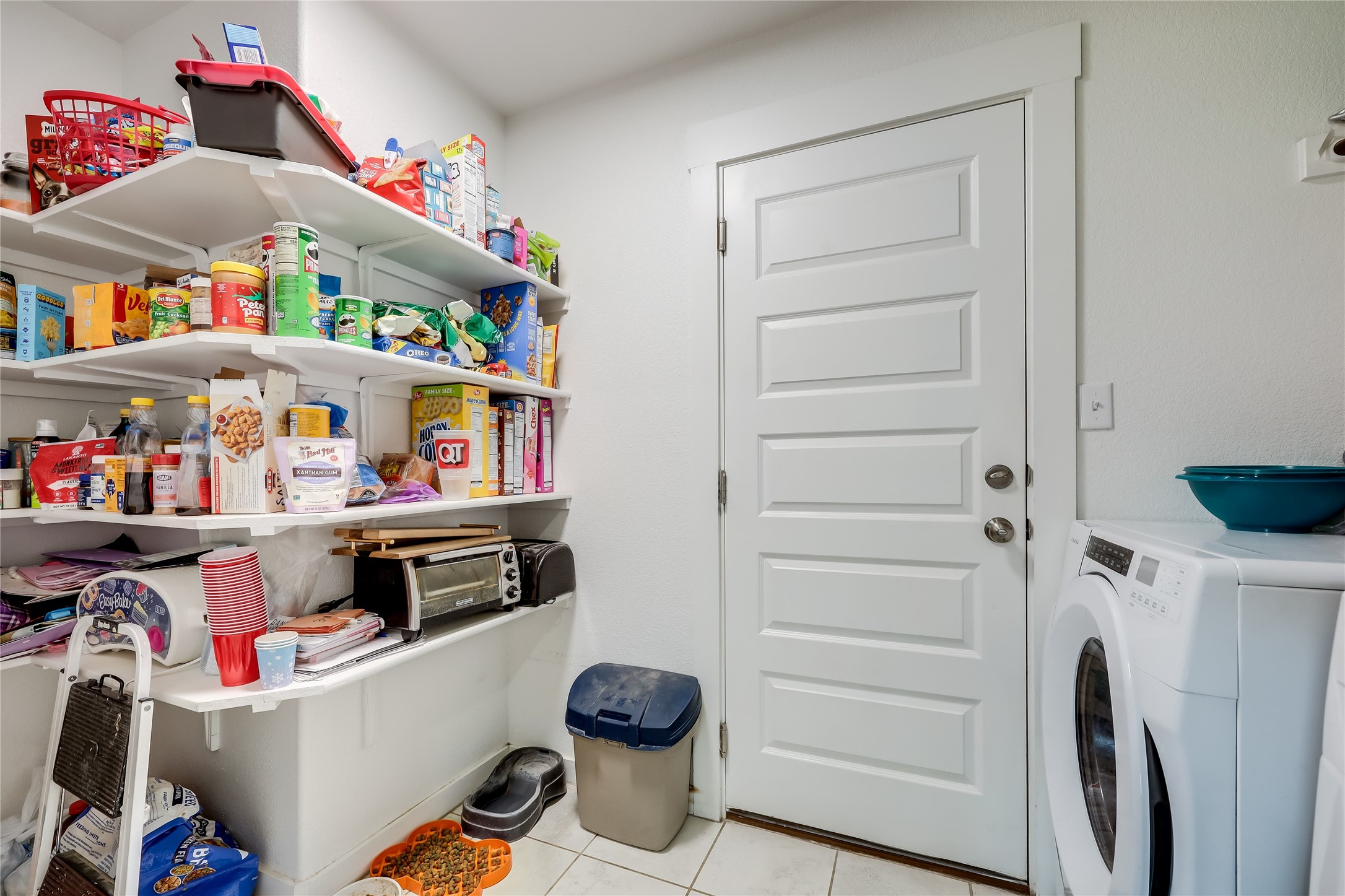 249 Trellis Boulevard Leander, TX 78641 - Photo 9 of 18 a storage room with washer and dryer