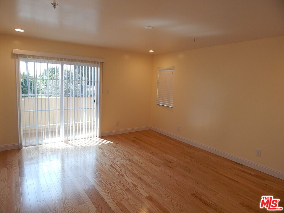 2018 Hillcrest Drive Los Angeles, CA 90016 - Photo 14 of 19 wooden floor in an empty room with a window