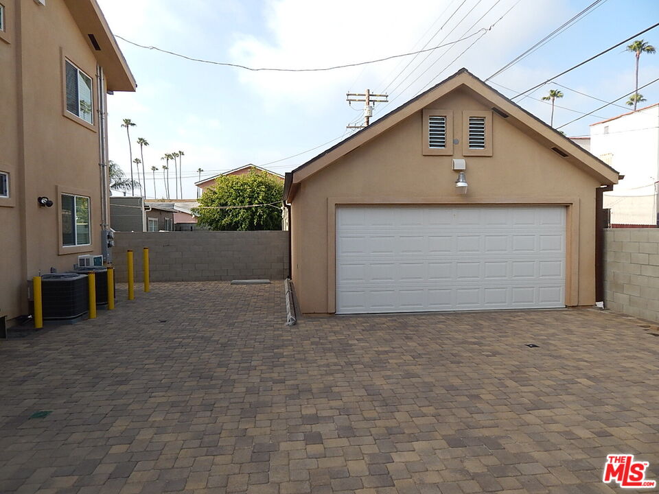 2018 Hillcrest Drive Los Angeles, CA 90016 - Photo 19 of 19 a front view of a house with a yard and garage