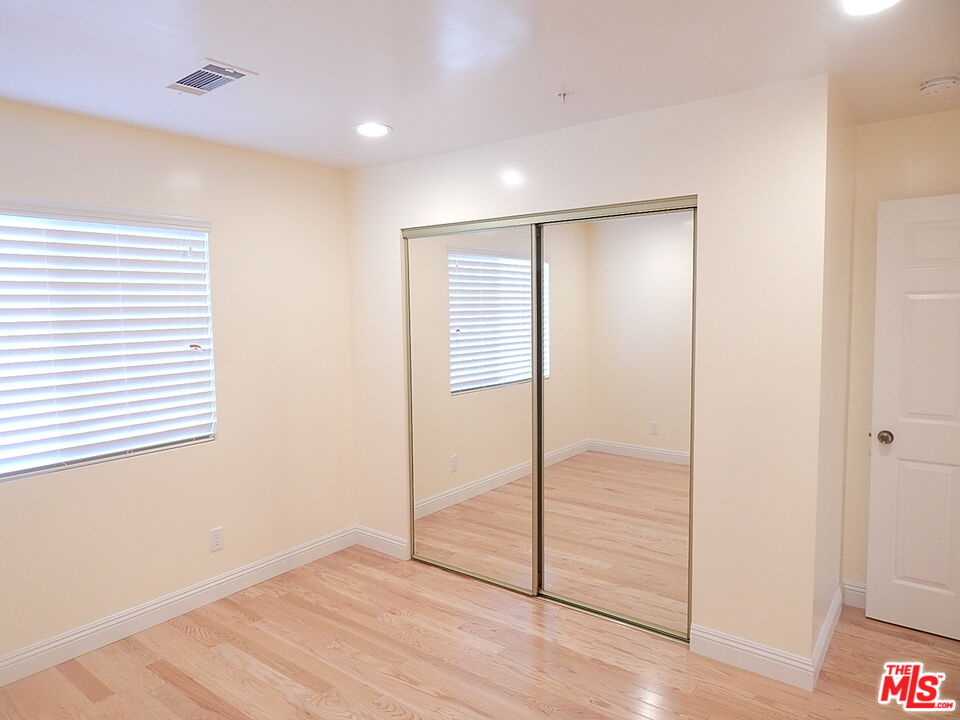 2018 Hillcrest Drive Los Angeles, CA 90016 - Photo 10 of 19 a view of an empty room with wooden floor