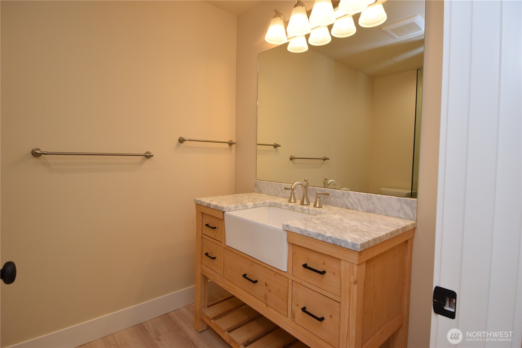 15915 Nesika Bay Road Northeast Poulsbo, WA 98370 - Photo 22 of 40 a bathroom with a sink vanity and a mirror
