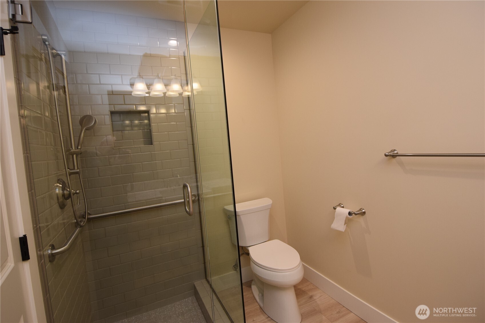15915 Nesika Bay Road Northeast Poulsbo, WA 98370 - Photo 23 of 40 a bathroom with a shower a toilet and sink