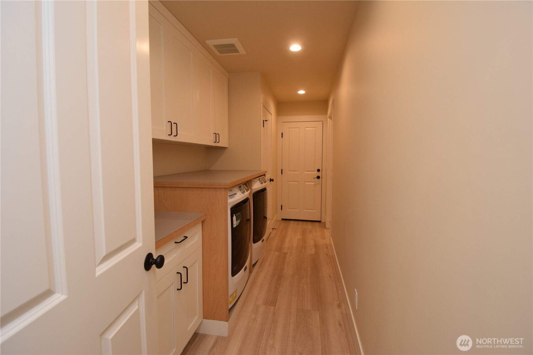 15915 Nesika Bay Road Northeast Poulsbo, WA 98370 - Photo 25 of 40 a view of a hallway with wooden floor and staircase