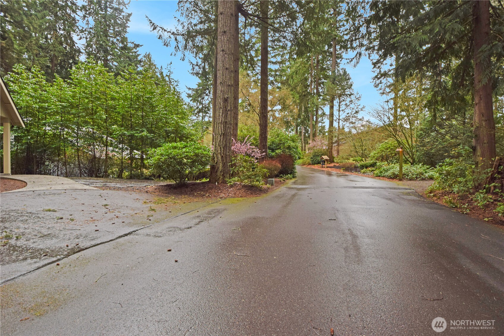 15915 Nesika Bay Road Northeast Poulsbo, WA 98370 - Photo 30 of 40 a view of a road with trees in the background