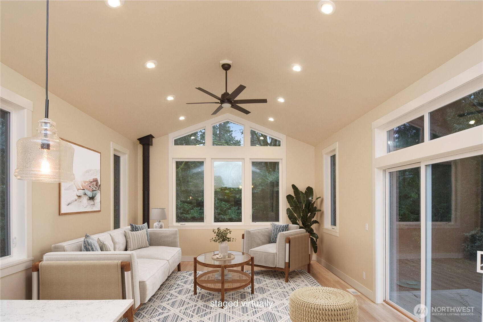 15915 Nesika Bay Road Northeast Poulsbo, WA 98370 - Photo 3 of 40 a living room with furniture and a large window