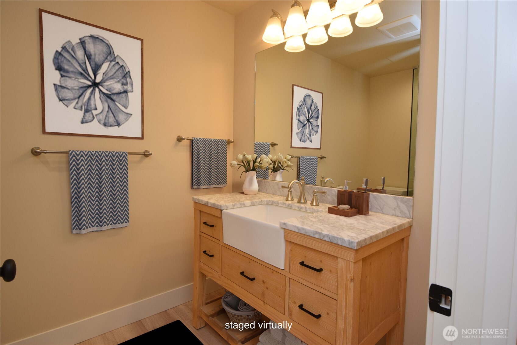 15915 Nesika Bay Road Northeast Poulsbo, WA 98370 - Photo 9 of 40 a bathroom with a sink vanity and a mirror