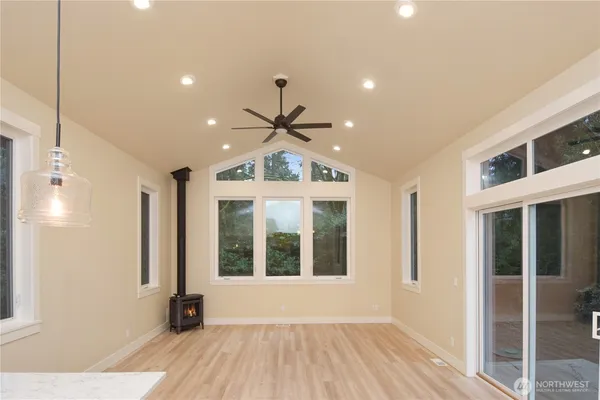 a view of an entryway with wooden floor and door