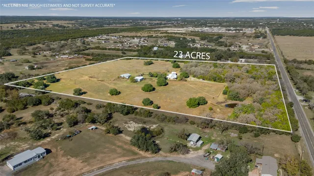 an aerial view of house with yard