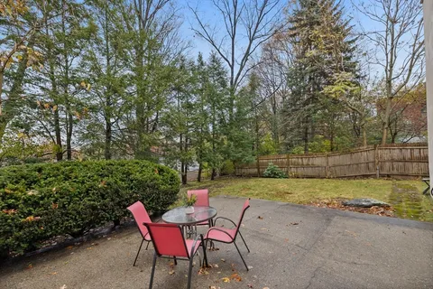 a view of a swimming pool with a lounge chair