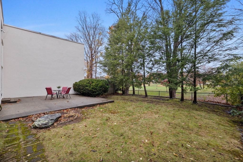 1 Charles Street, Unit N Reading, MA 01867 - Photo 16 of 17 a view of a yard with a tree