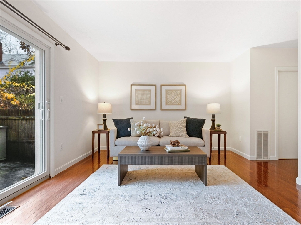 1 Charles Street, Unit N Reading, MA 01867 - Photo 2 of 17 a living room with furniture and a rug