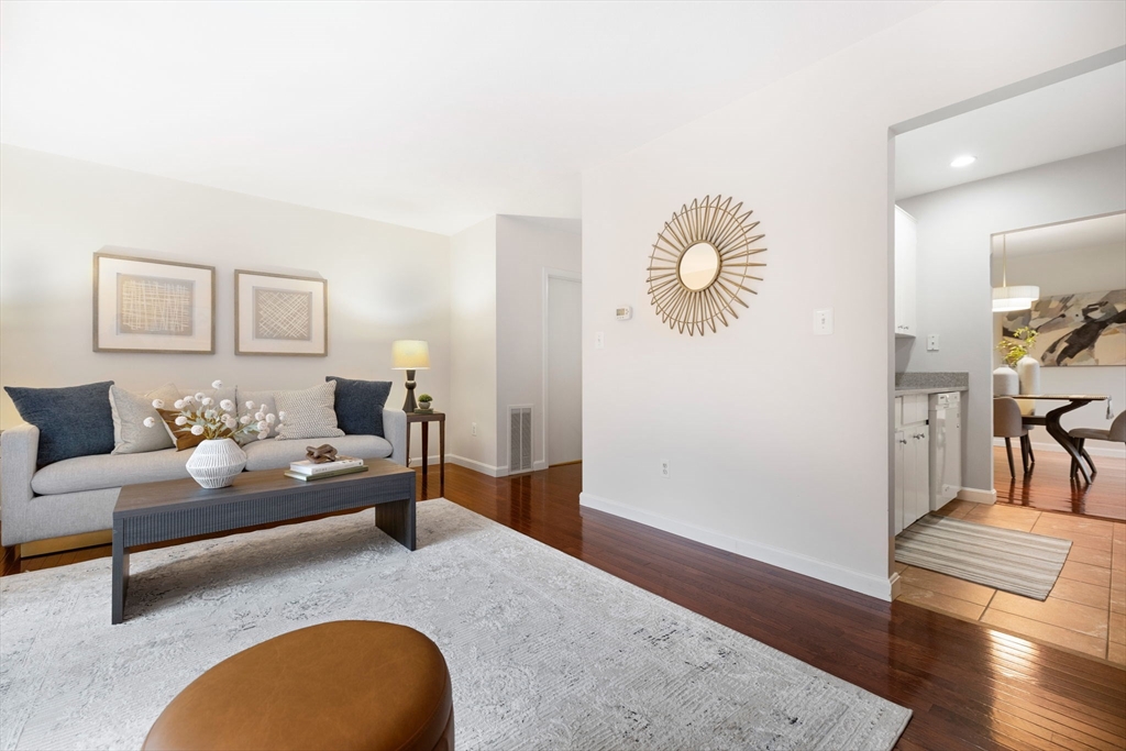 1 Charles Street, Unit N Reading, MA 01867 - Photo 4 of 17 a living room with furniture and wooden floor