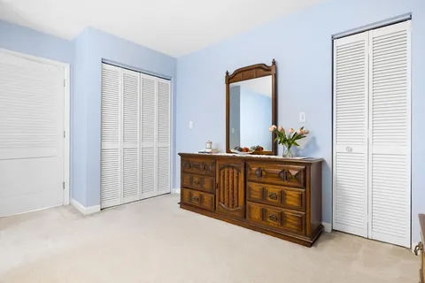 a room with furniture and mirror