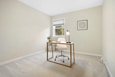a view of a room with table and chair
