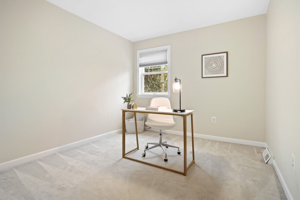 1 Charles Street, Unit N Reading, MA 01867 - Photo 10 of 17 a view of a room with table and chair