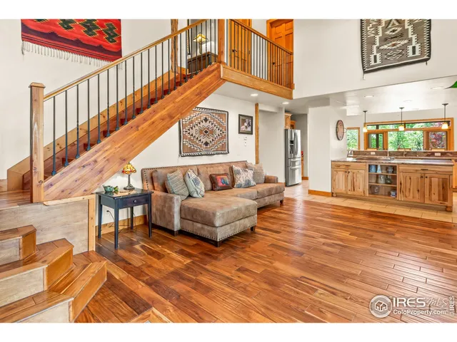 a kitchen with stainless steel appliances kitchen island granite countertop a table and chairs