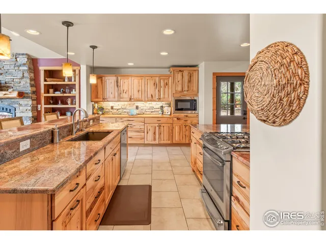 a bathroom with a tub a sink and a window