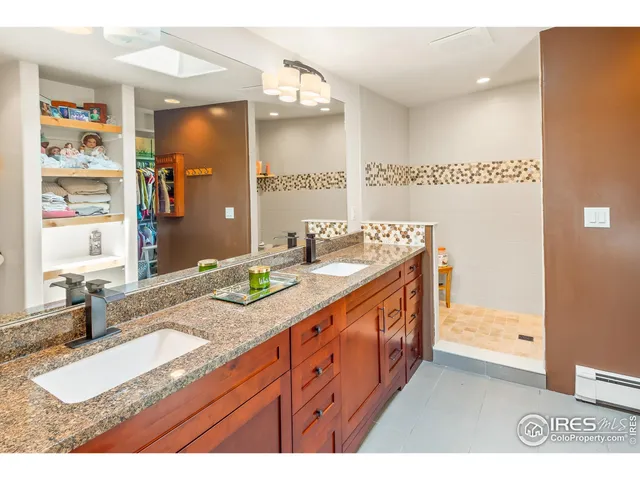a living room with furniture a fireplace and a floor to ceiling window
