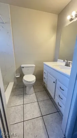 a bathroom with a shower and a toilet