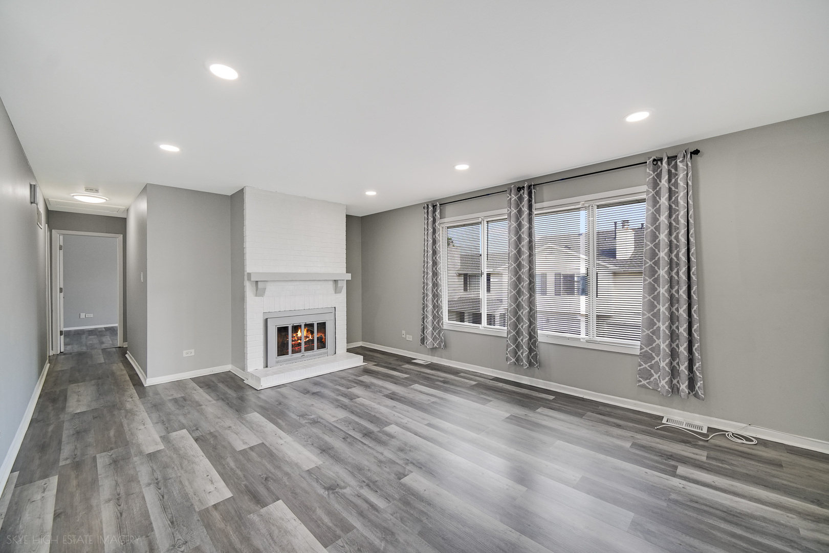 103 Red Barn Road, Unit 103 Matteson, IL 60443 - Photo 8 of 17 a view of an empty room with a window and fireplace