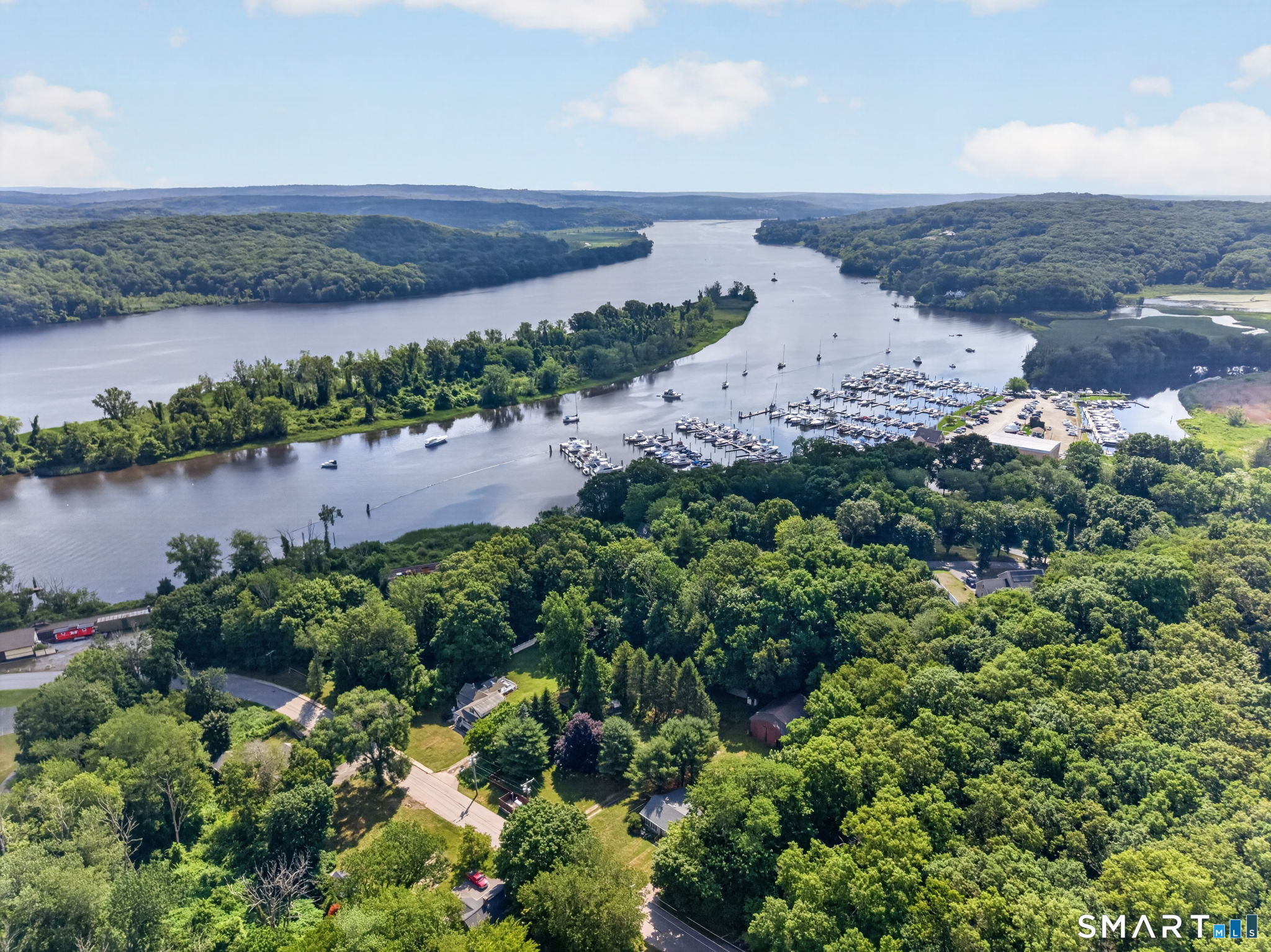 79 River Street Deep River, CT 06417 - Photo 39 of 40 a view of a lake with a mountain