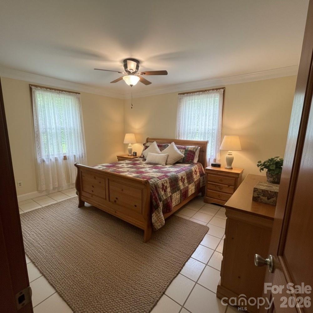 2051 Sutton Spring Road York, SC 29745 - Photo 25 of 47 a spacious bedroom with a bed and window
